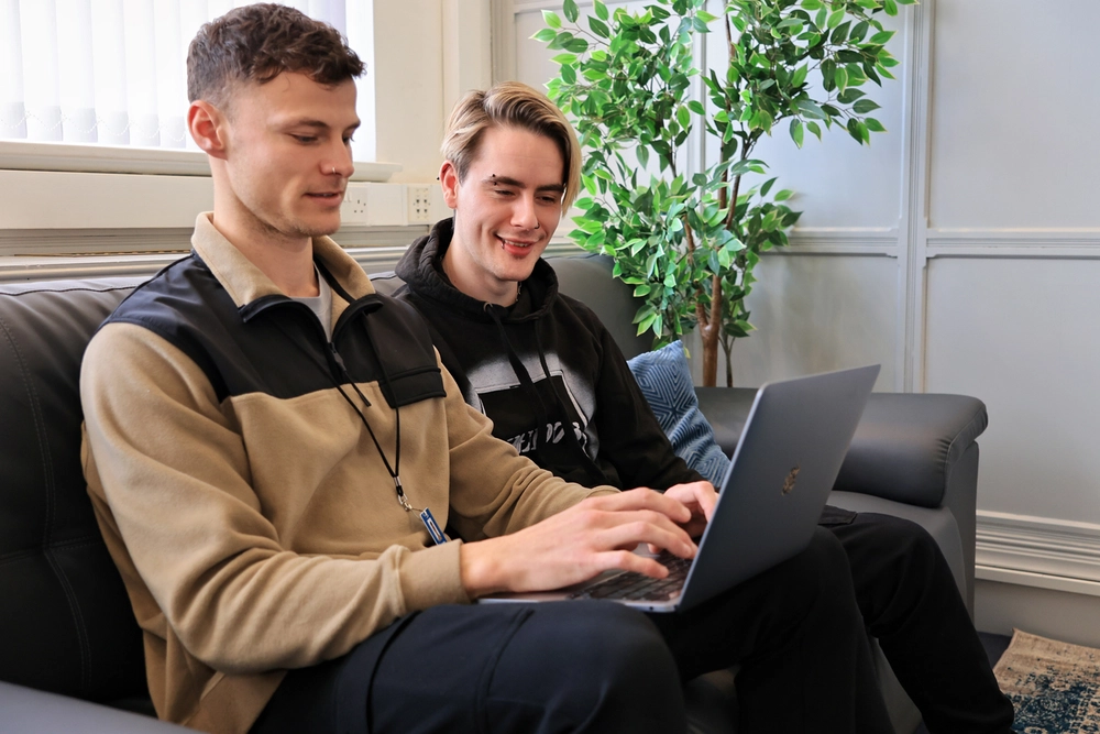Two adults taking part in a supportive neurodivergent coaching session