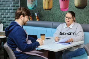 Workplace support and training helping employee with ADHD succeed in hospitality role